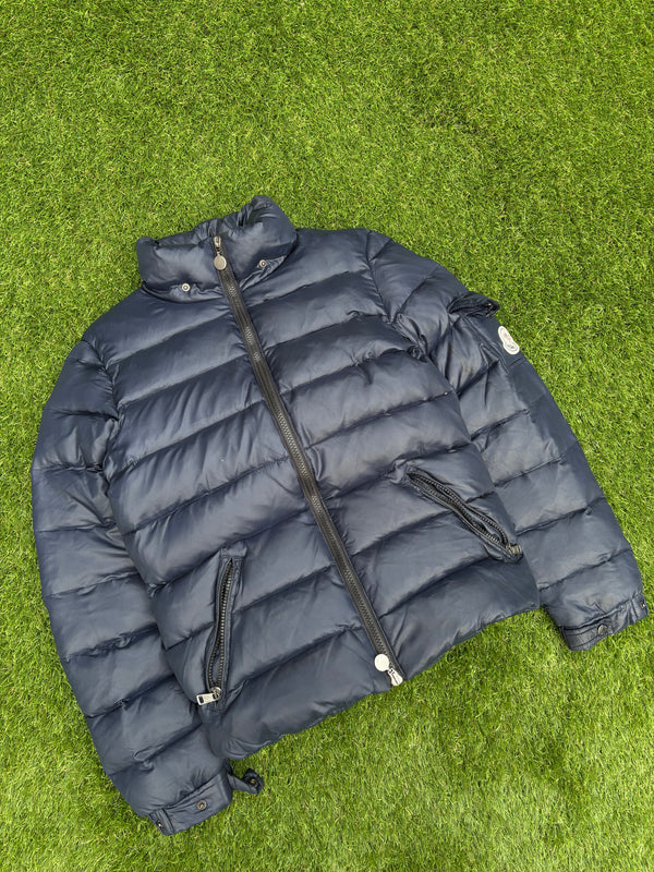 navy blue Moncler down puffer jacket with a glossy nylon finish