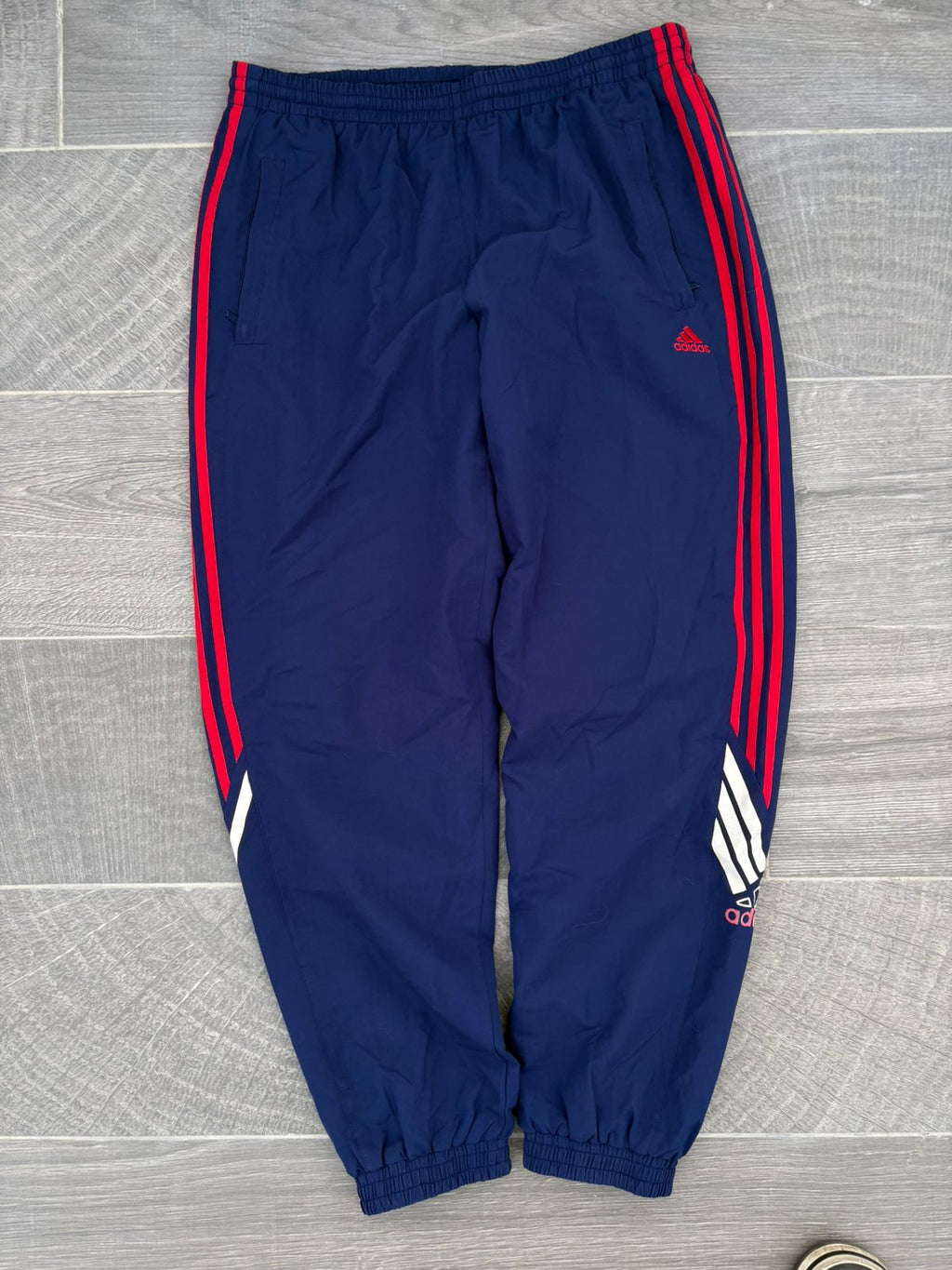 Navy and red adidas pants