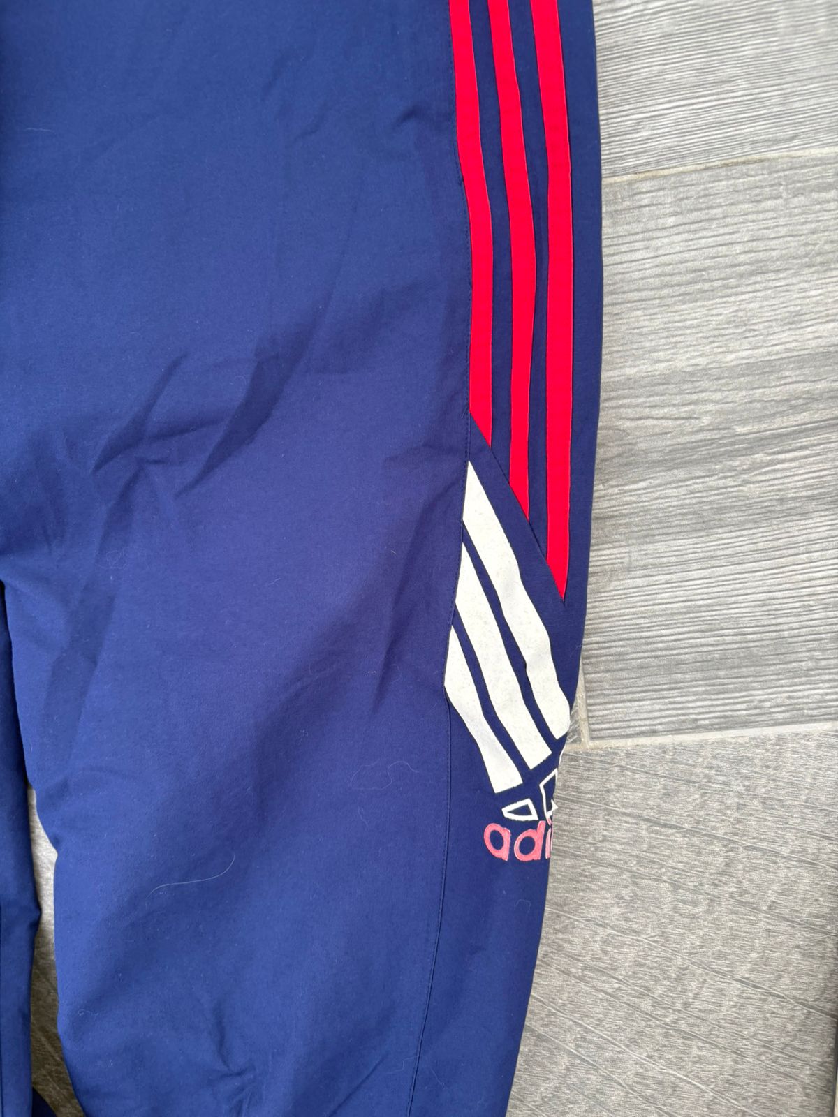 Navy and red adidas pants