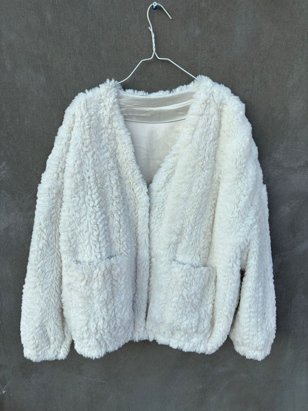 Heavy white faux-fur or "teddy" cropped jacket