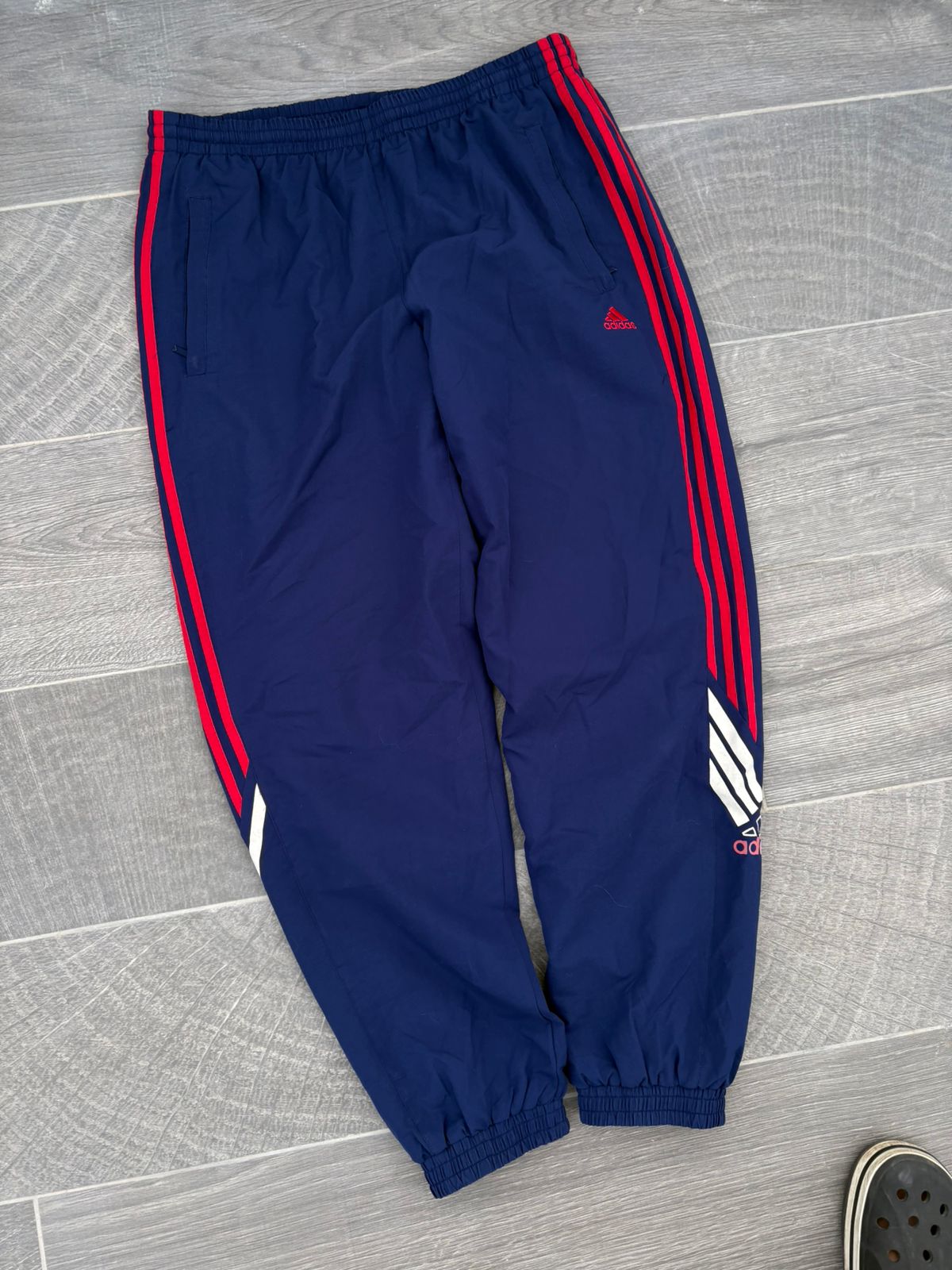 Navy and red adidas pants