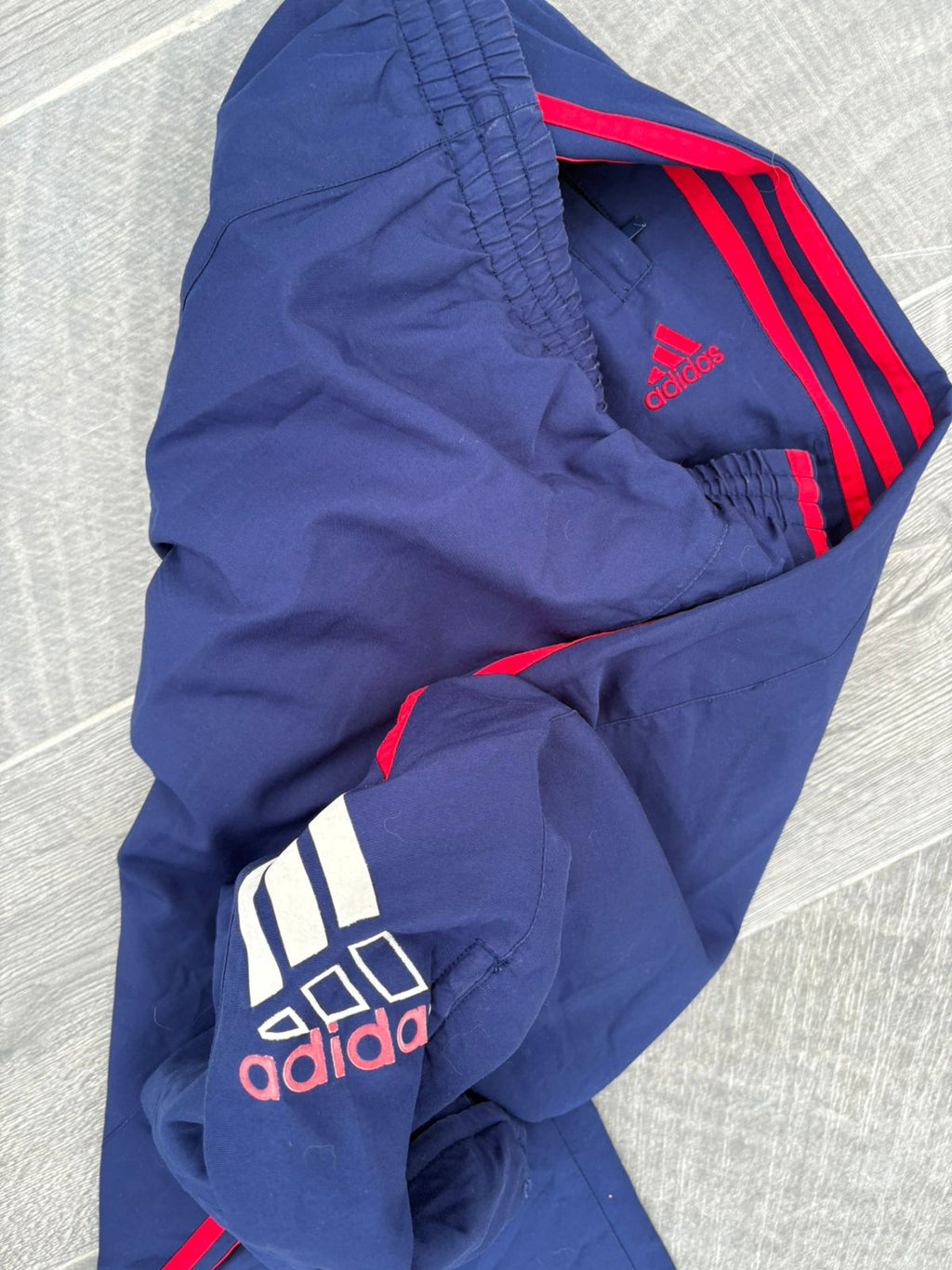 Navy and red adidas pants