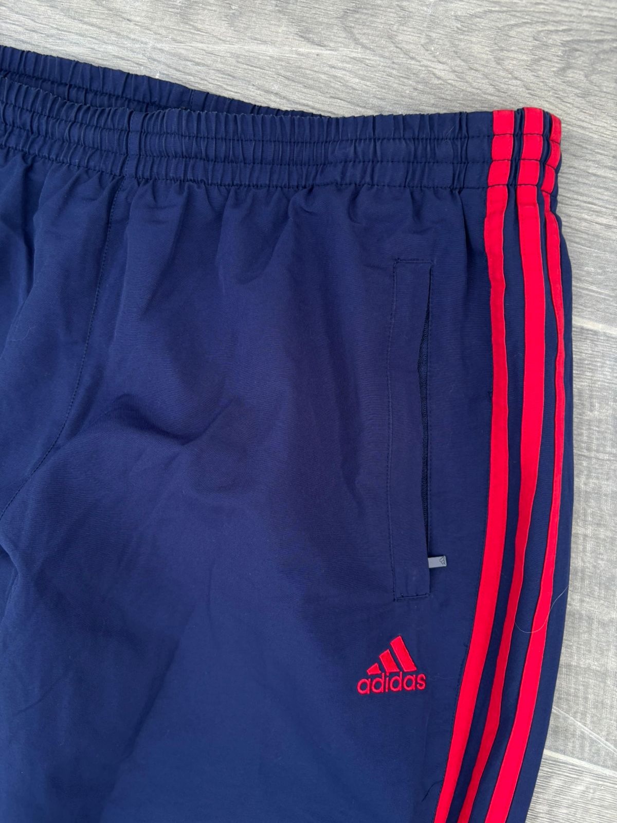 Navy and red adidas pants