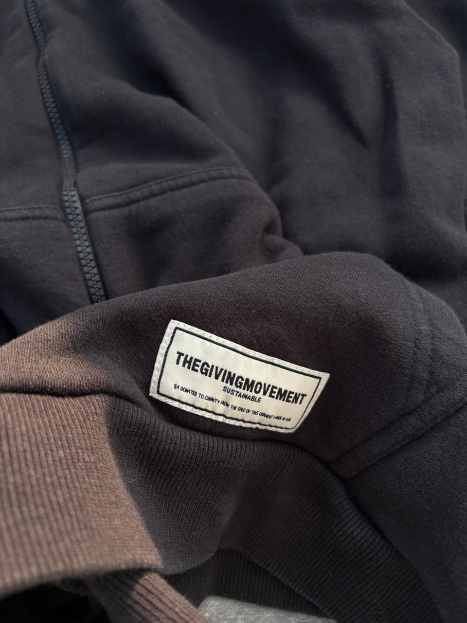 the giving movment black zip up jacket