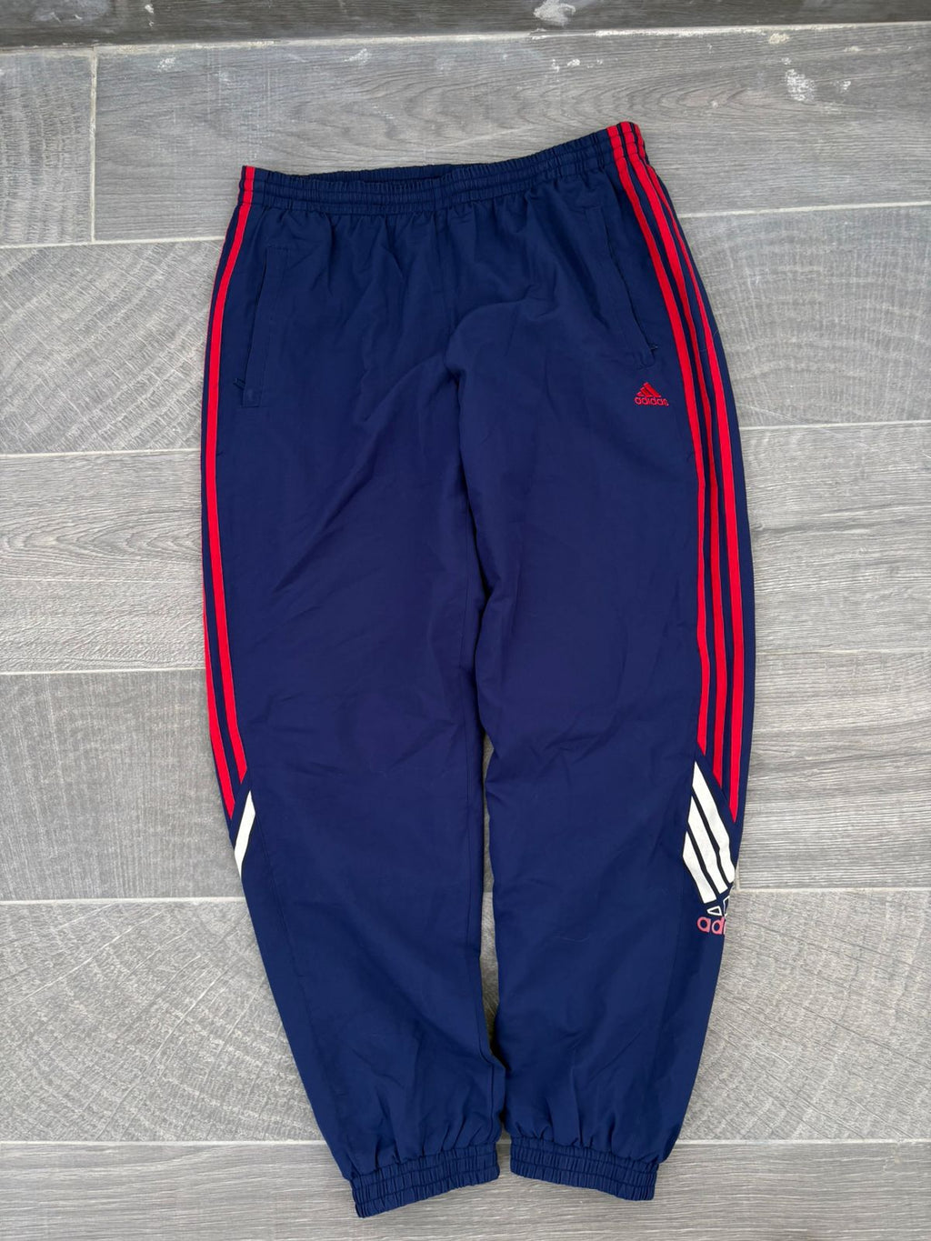 Navy and red adidas pants